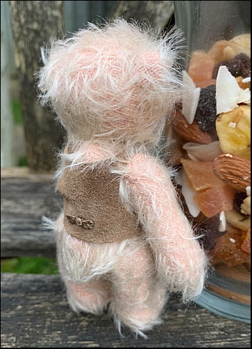 Roderick inspects the nuts in the jar